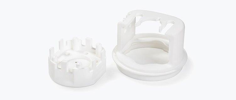 A white 3D-printed tool made in PA 12 Medical-Grade using selective laser sintering.
