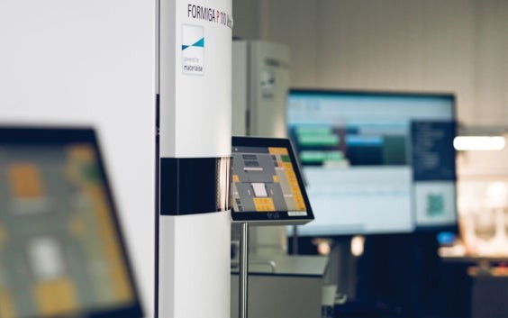 Multiple 3D printers in a row in a Materialise production facility