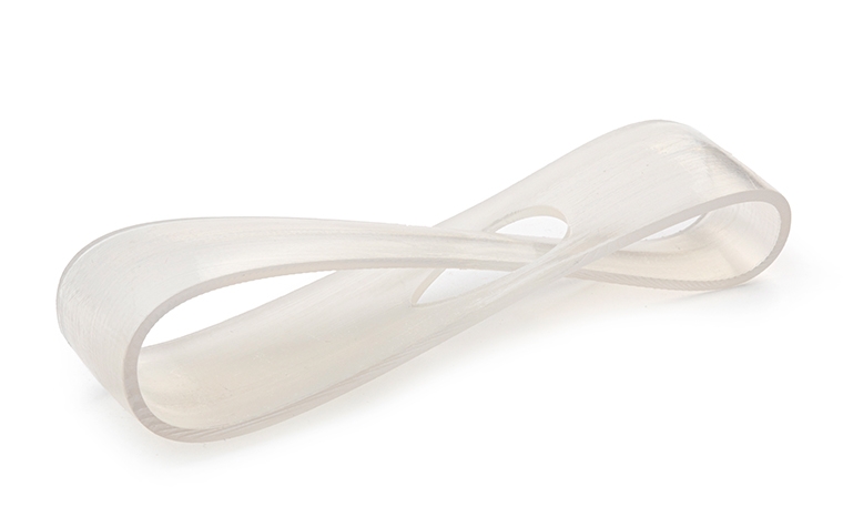 A transparent 3D-printed loop made with Poly 1500 using stereolithography, finished by removing all support marks.
